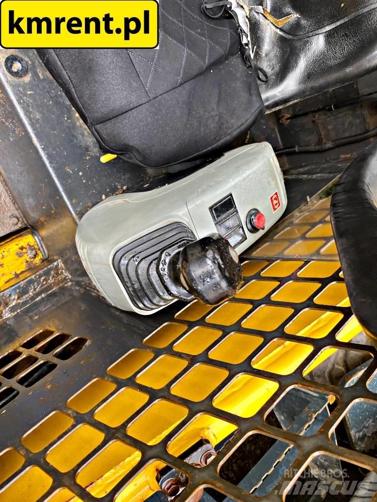 Komatsu SK 815 Minilæsser - skridstyret
