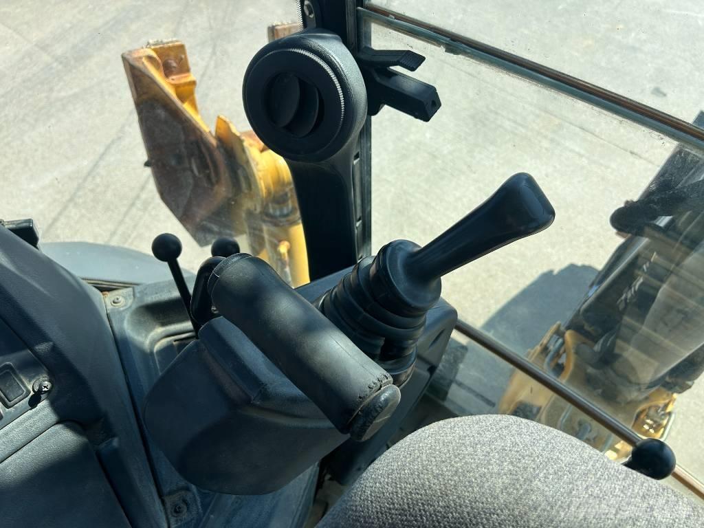 John Deere 310K Rendegravere