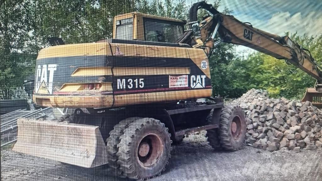 CAT M 315 Gravemaskiner på hjul
