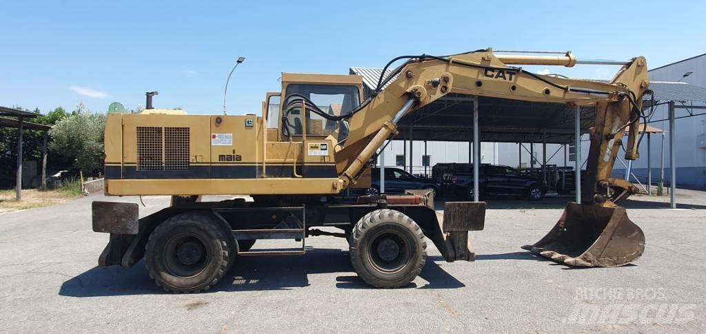 CAT 214 B Gravemaskiner på hjul