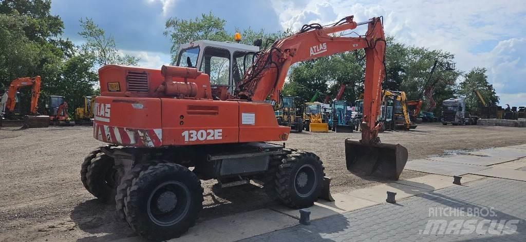Atlas 1302 E Gravemaskiner på hjul