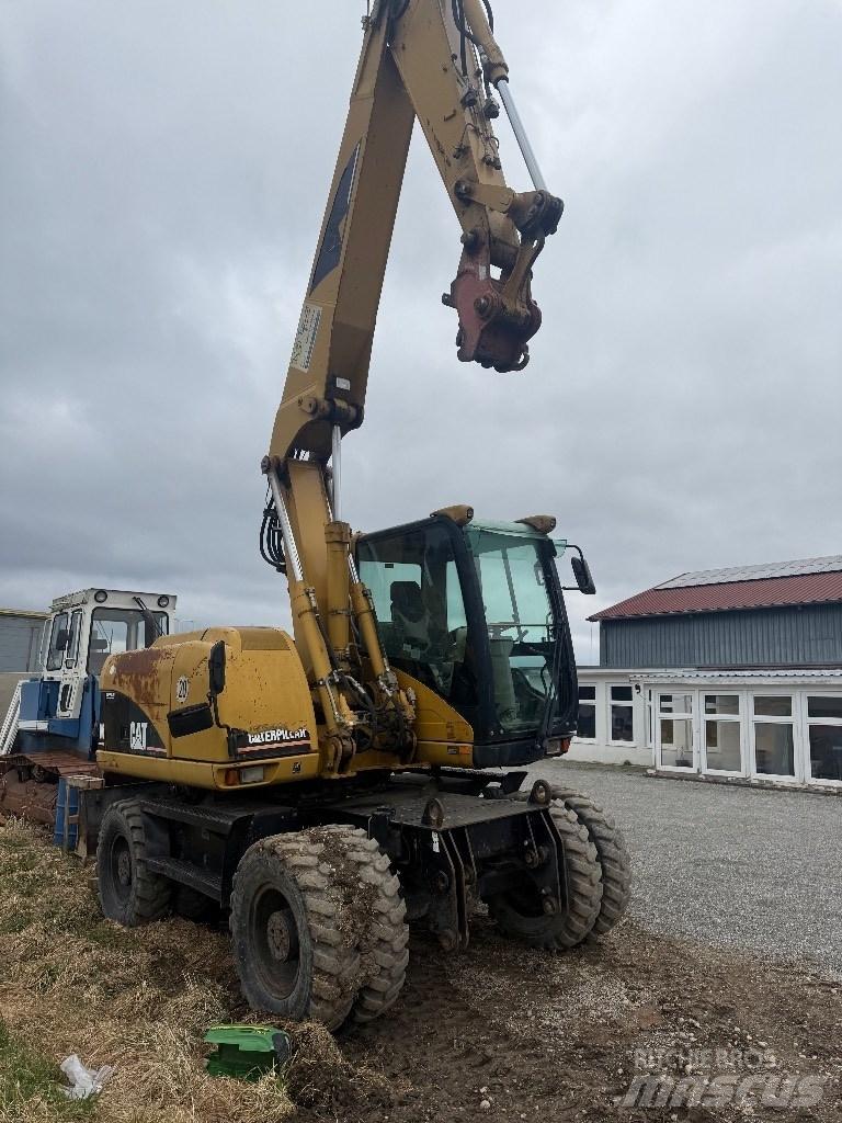 CAT M 313 C Gravemaskiner på hjul