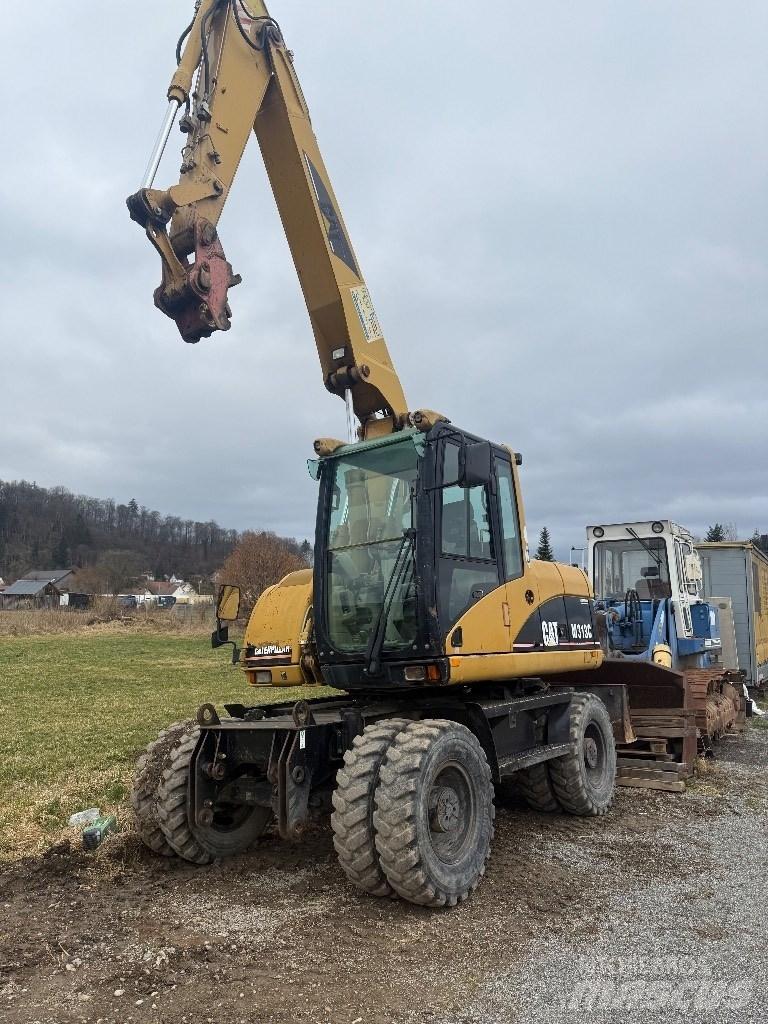 CAT M 313 C Gravemaskiner på hjul