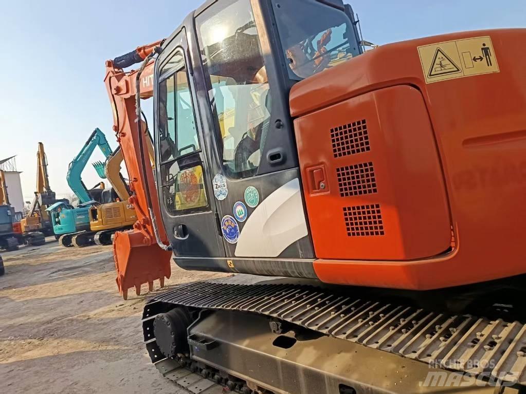 Hitachi ZX135 Gravemaskiner på larvebånd