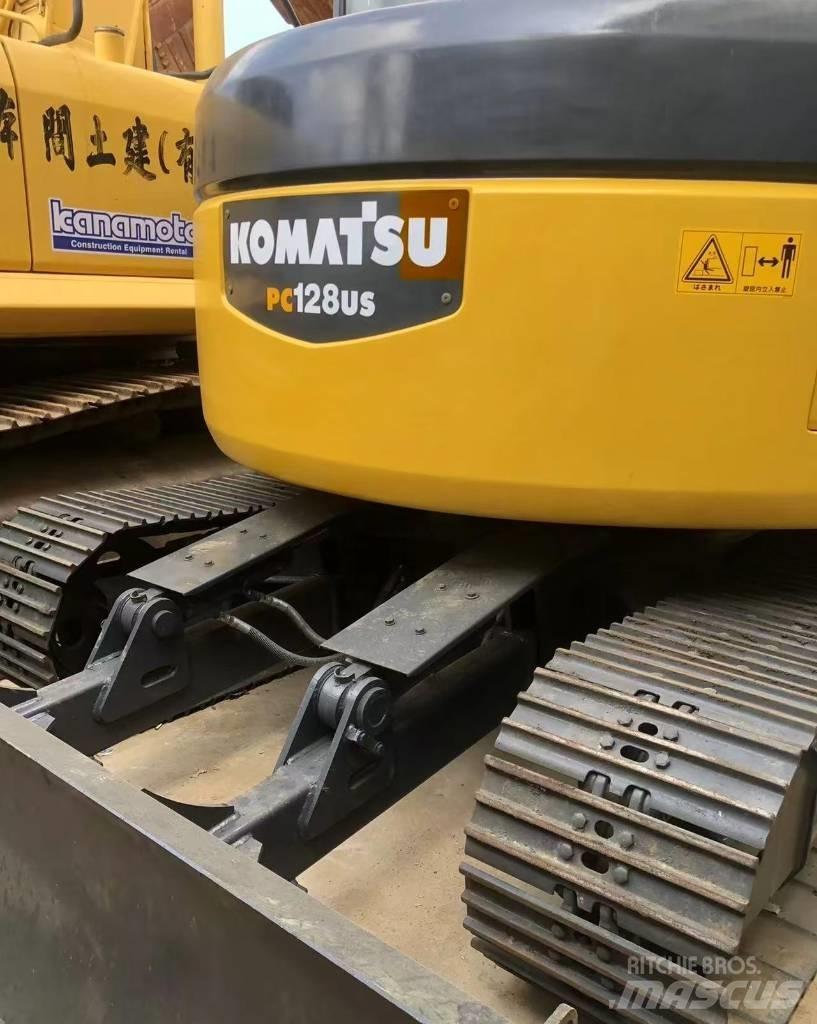 Komatsu 128 US Gravemaskiner på larvebånd