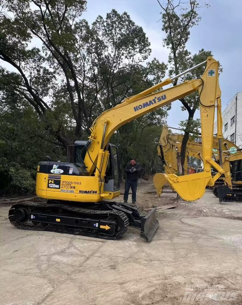 Komatsu 128 US Gravemaskiner på larvebånd