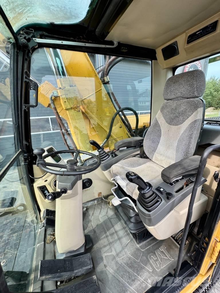 CAT M 318 C Gravemaskiner på hjul