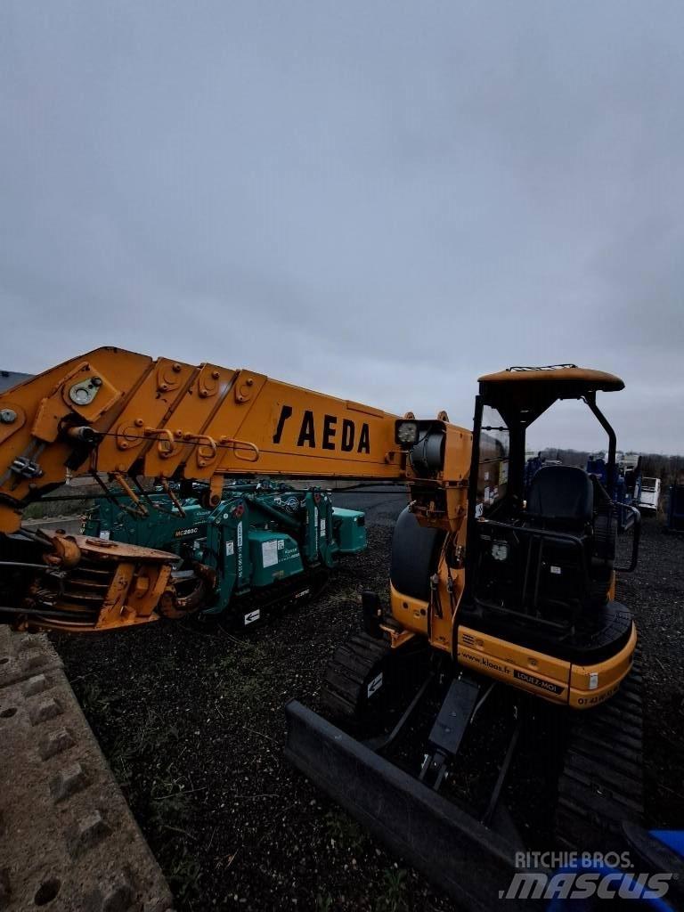 Maeda CC 423 Kraner på larvebånd