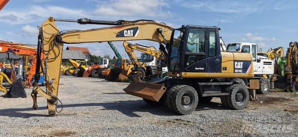 CAT M 315 D Gravemaskiner på hjul