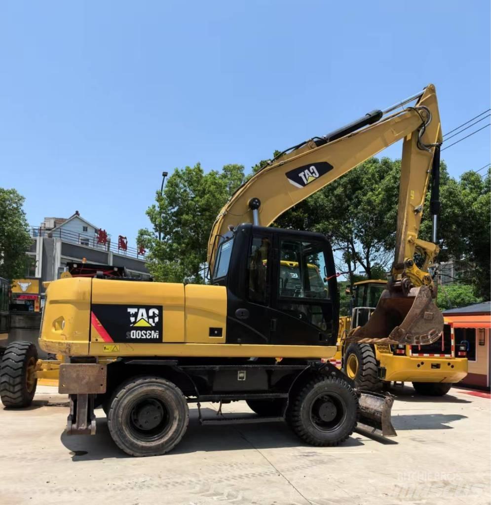 CAT M 320 Gravemaskiner på hjul