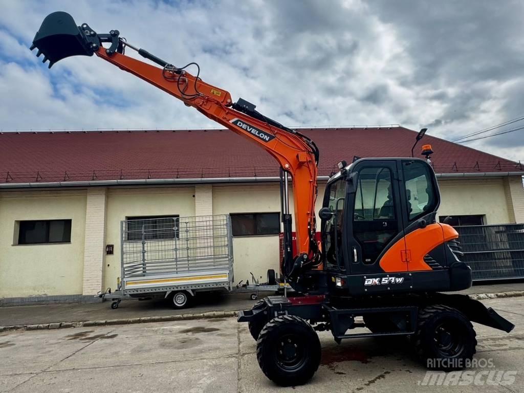 Develon DX 57 W-7 Gravemaskiner på hjul