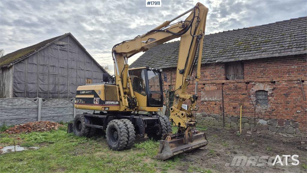 CAT M312 Gravemaskiner på hjul