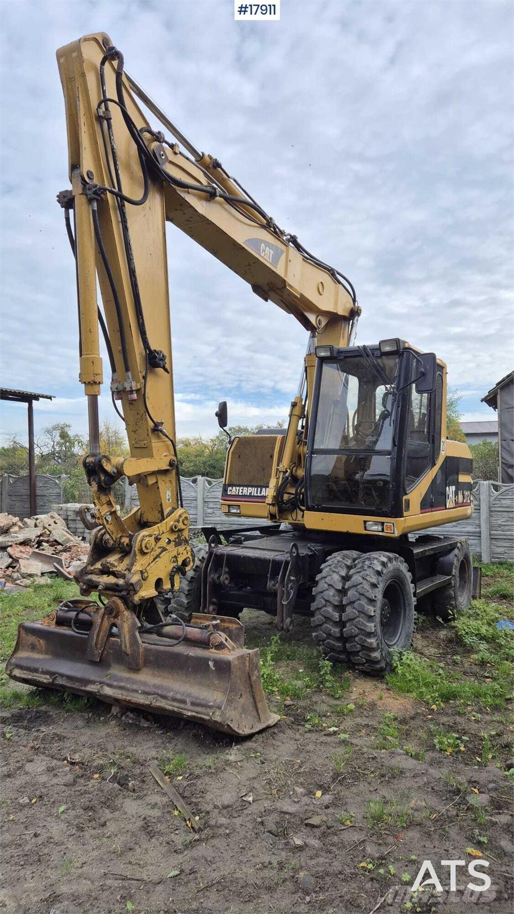 CAT M312 Gravemaskiner på hjul