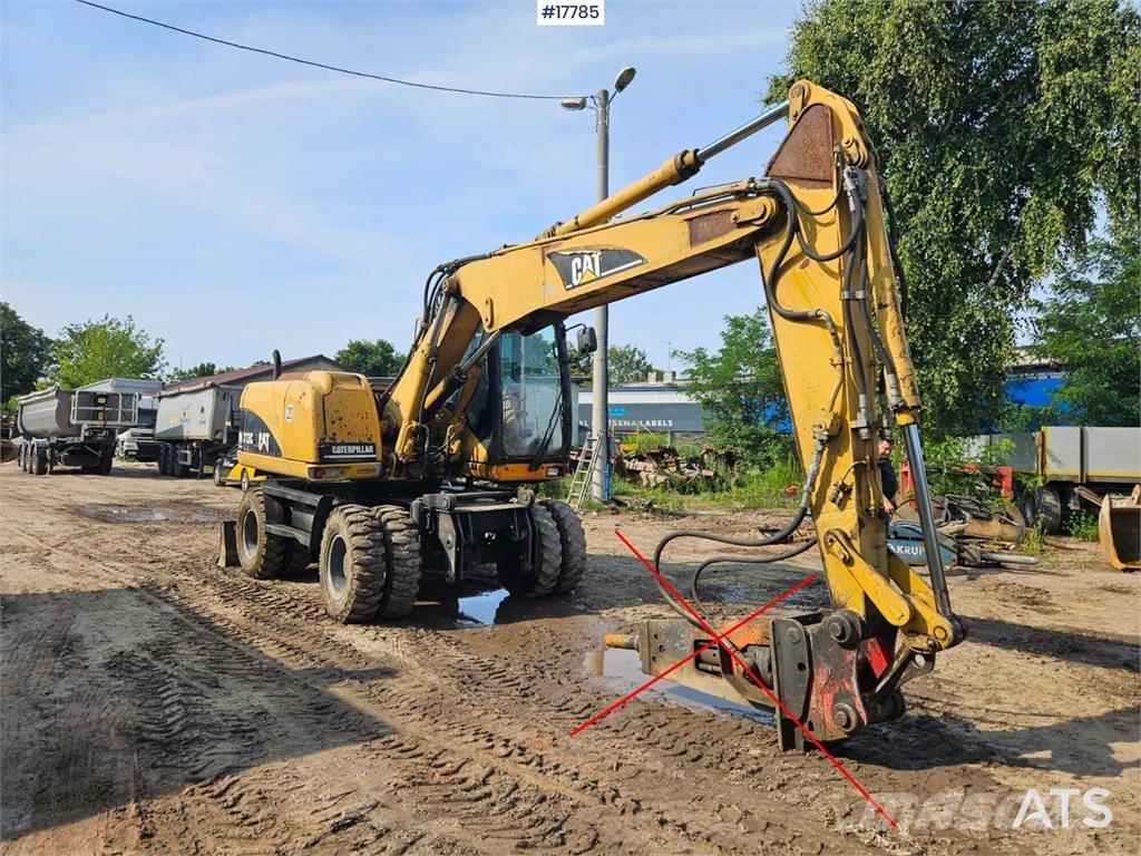 CAT M313 C Gravemaskiner på hjul