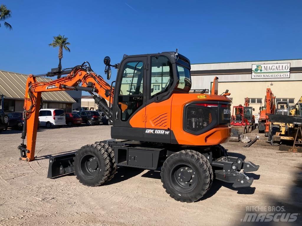 Develon DX 100 W-7 Gravemaskiner på hjul