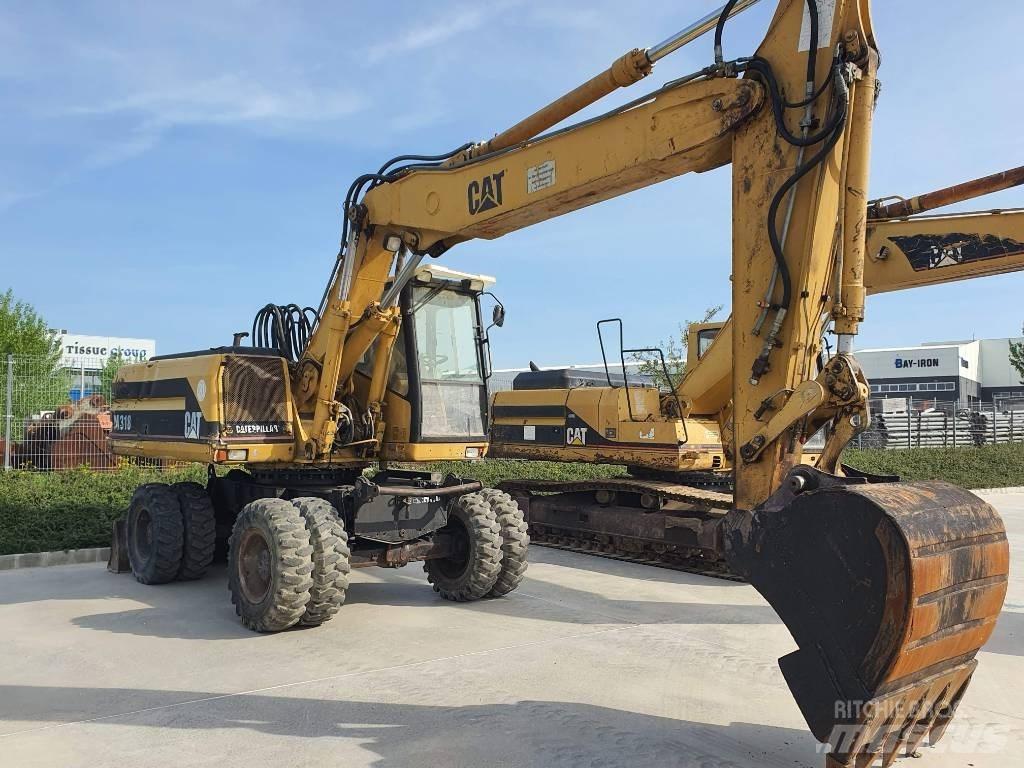 CAT M 318 Gravemaskiner på hjul