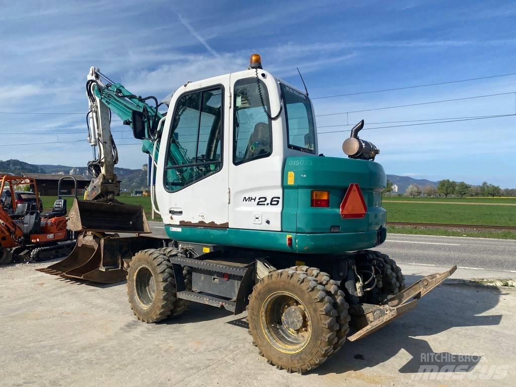 New Holland MH 2.6 Gravemaskiner på hjul