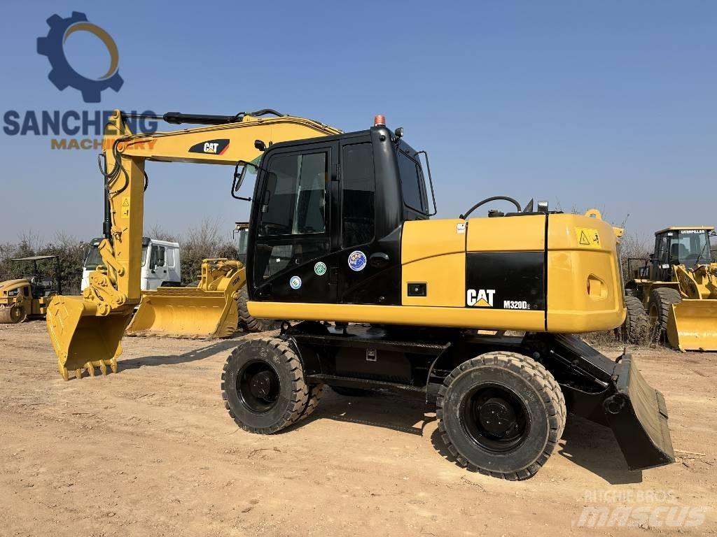 CAT M 320 D Gravemaskiner på hjul