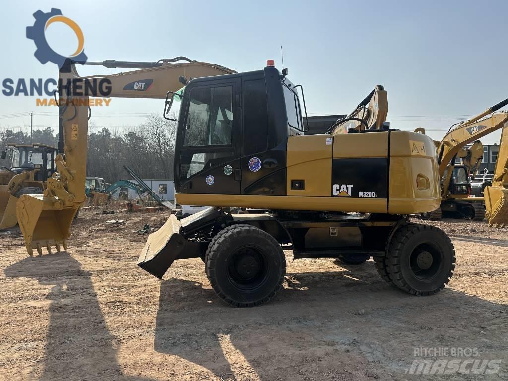 CAT M 320 D Gravemaskiner på hjul