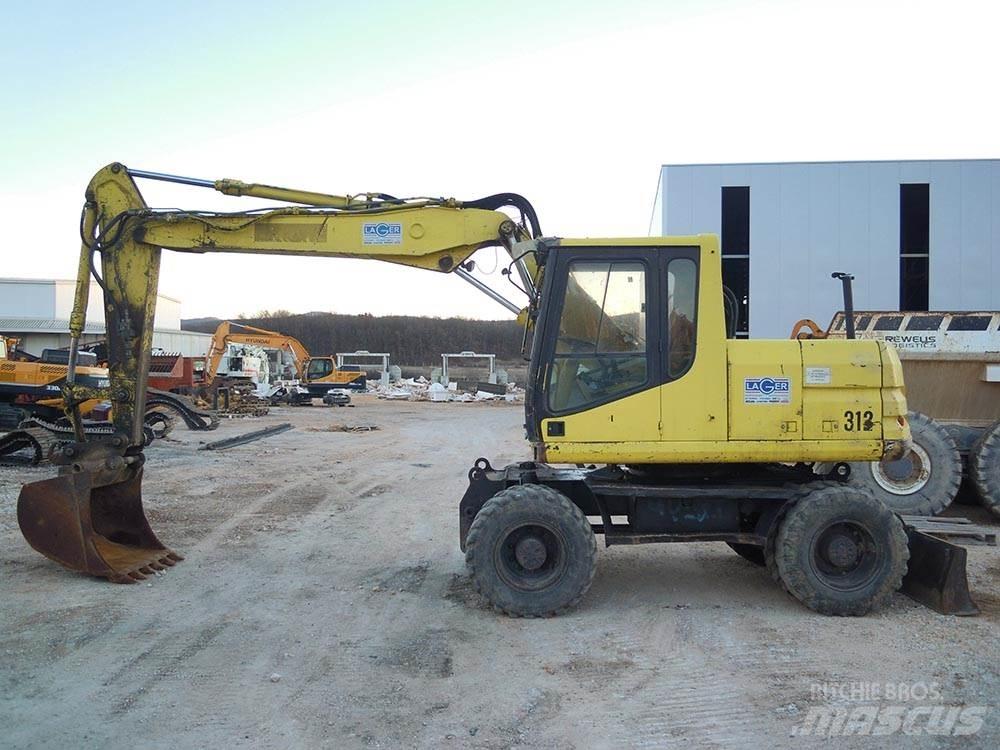 CAT M312 Gravemaskiner på hjul