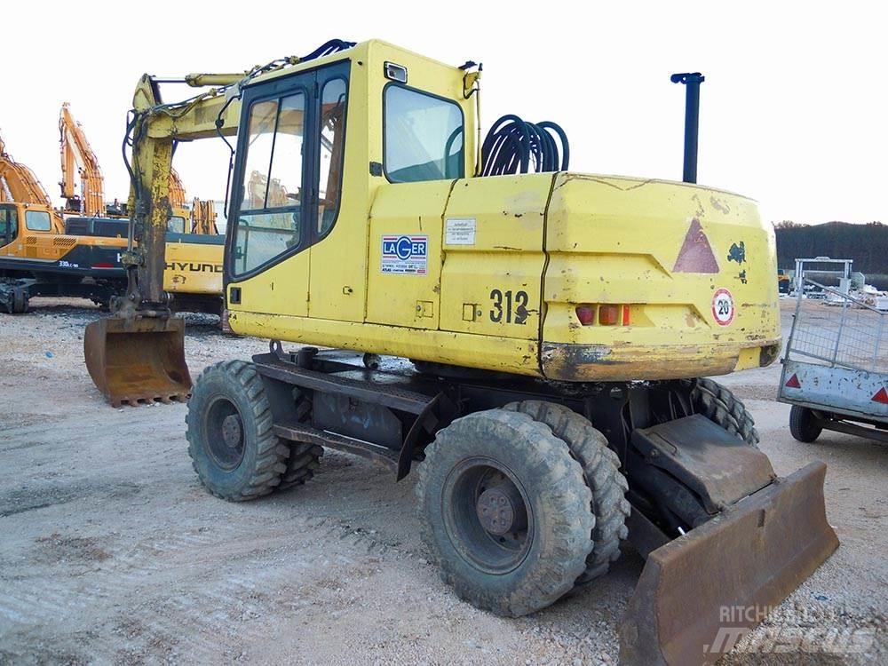 CAT M312 Gravemaskiner på hjul