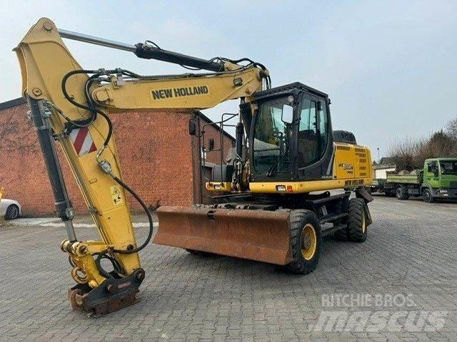 New Holland WE210 Gravemaskiner på hjul