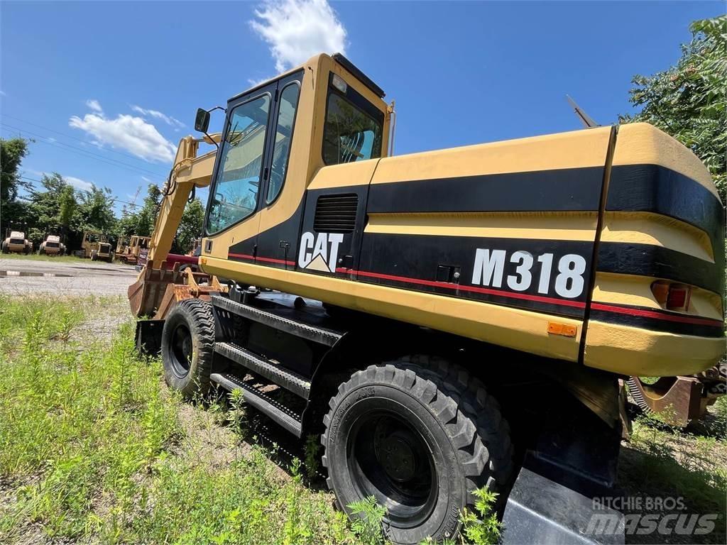 CAT M318 Gravemaskiner på hjul