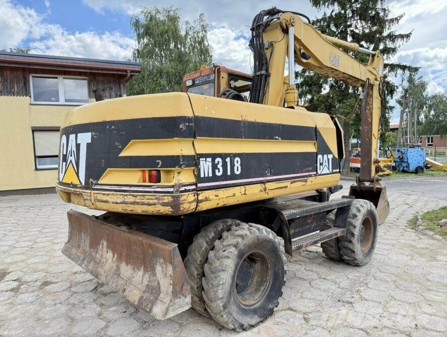 CAT M318 Gravemaskiner på hjul