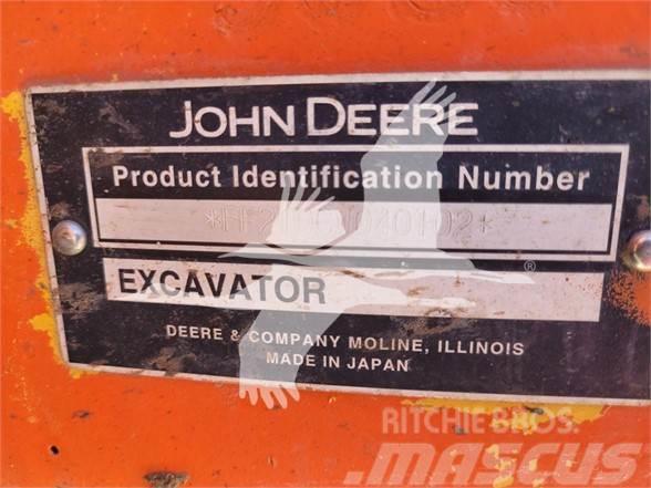 John Deere 210C W Gravemaskiner på hjul